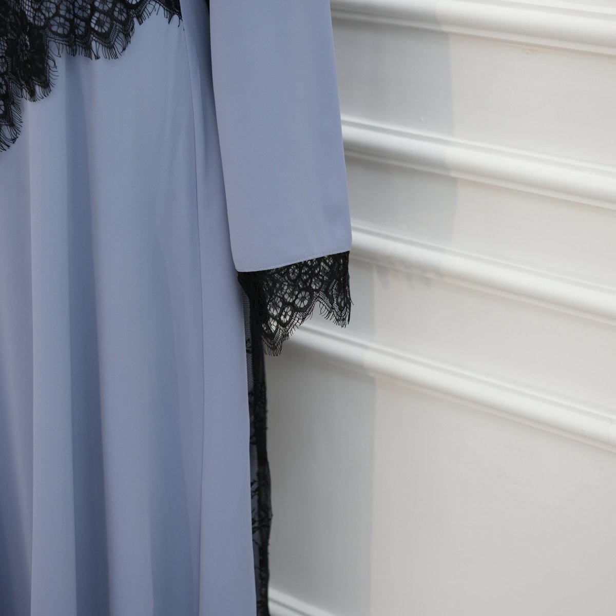 Back view of sheer lace skirt panel from waist to hem on maxi dress