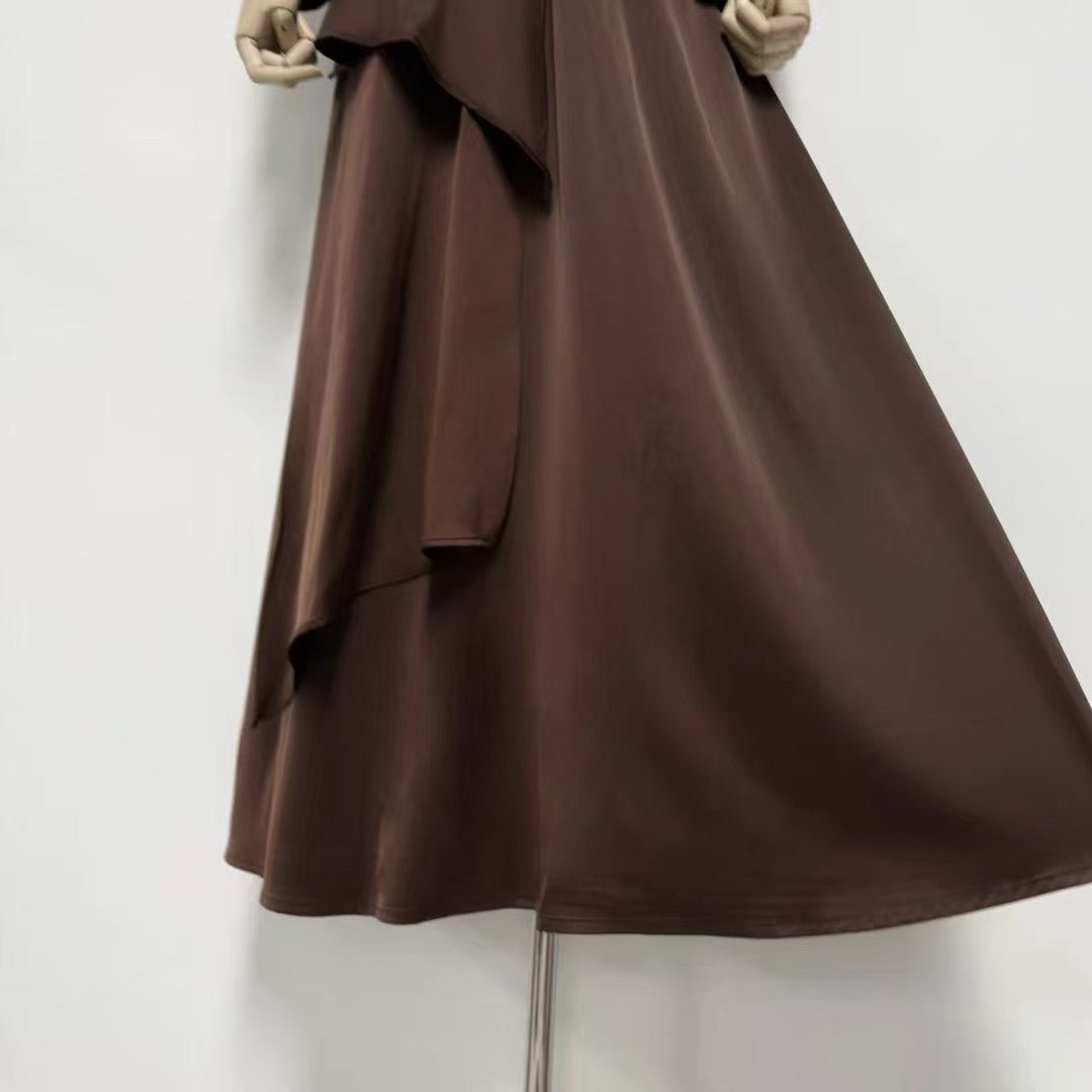 Asymmetric ruffle panels at hem of floor-length formal dress