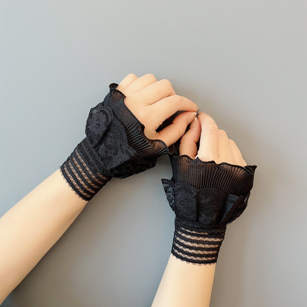 Lace wrist cuffs with multiple rows of delicate lace trim detail