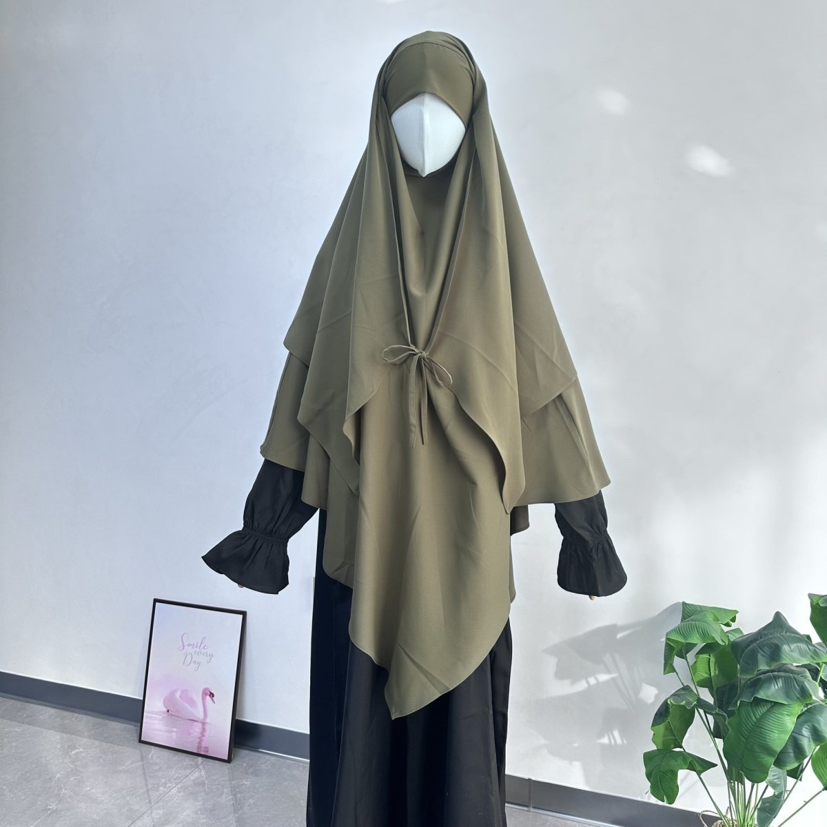 Colour detail of two-tone tie-front khimar with contrast sleeve design