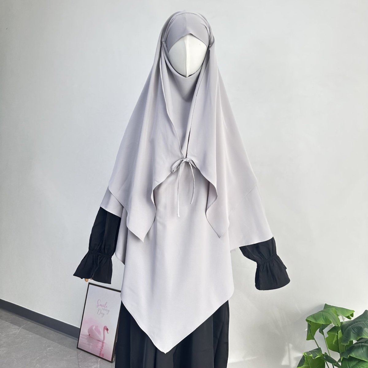 Detail of drawstring tie closure on lightweight nida khimar