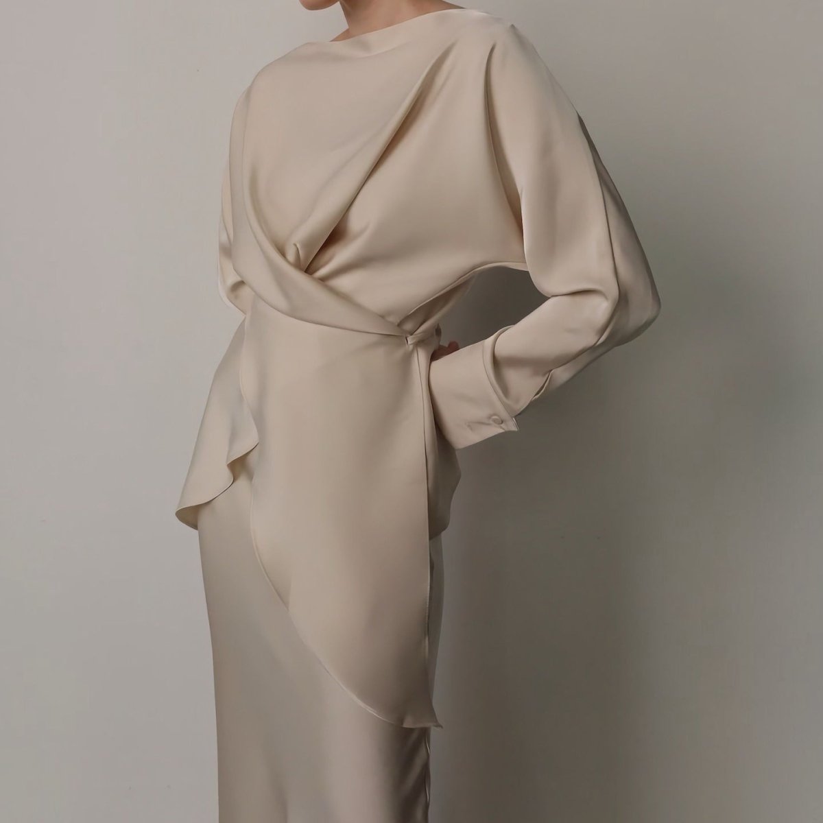 Back tie detail of powder blue satin wrap top