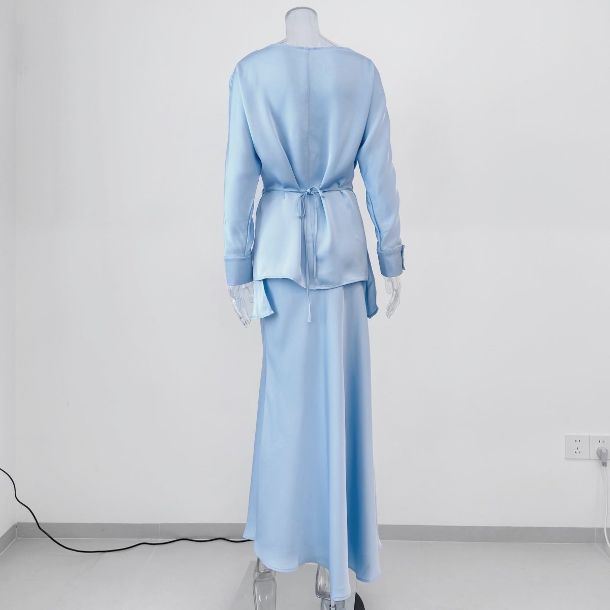 Button cuff detail on long satin sleeves