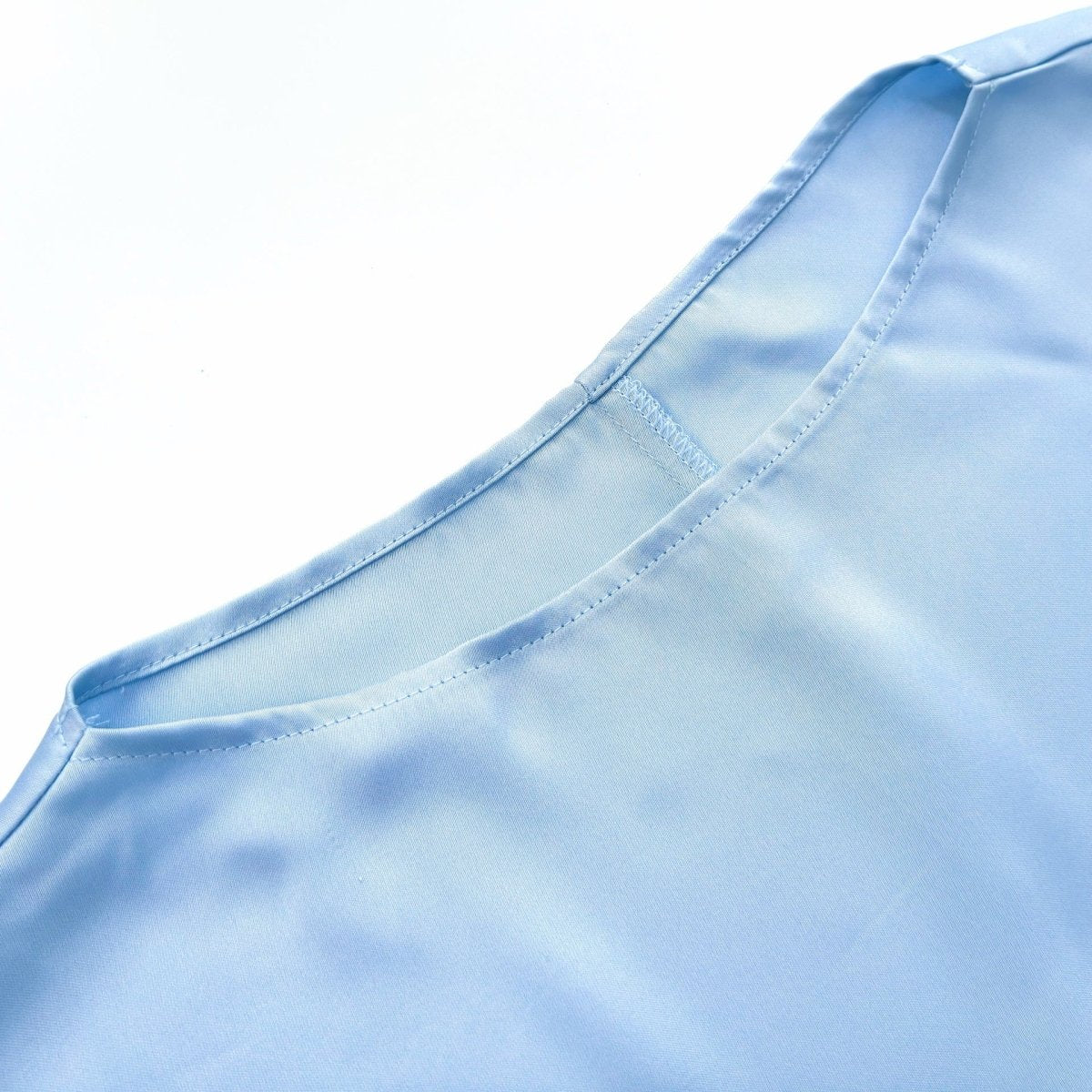 Side view of two-piece satin maxi skirt suit set