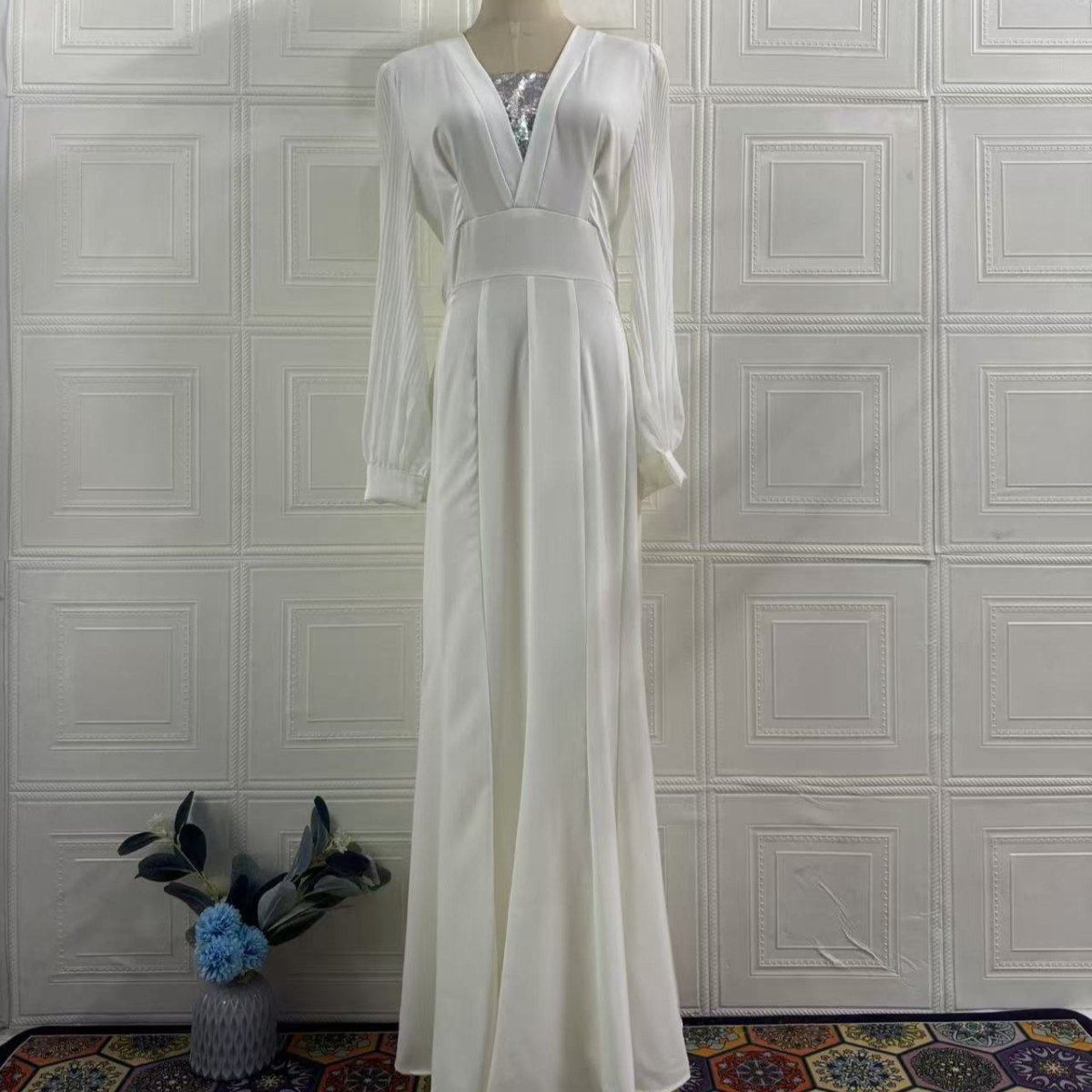 Close-up of deep V-neckline with delicate lace trim on elegant formal dress
