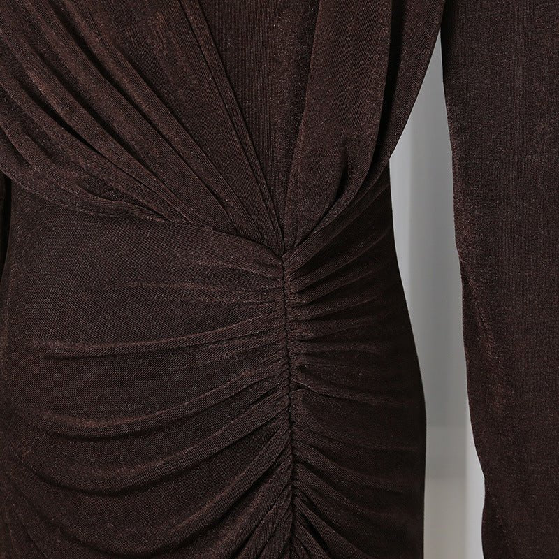 Three-quarter view of ruched diagonal pleat abaya gown showing sculptural silhouette