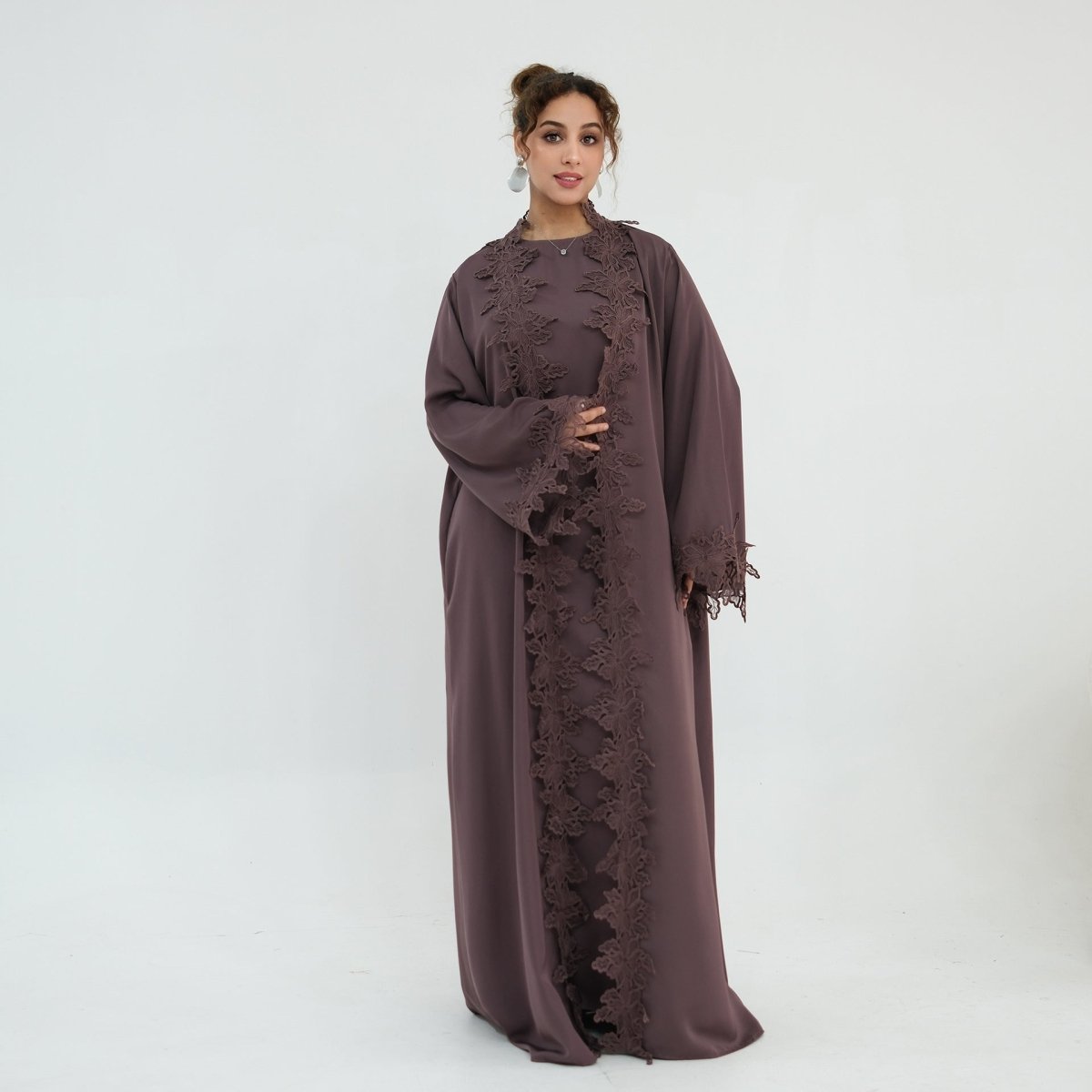 Open abaya styled over sleeveless inner dress