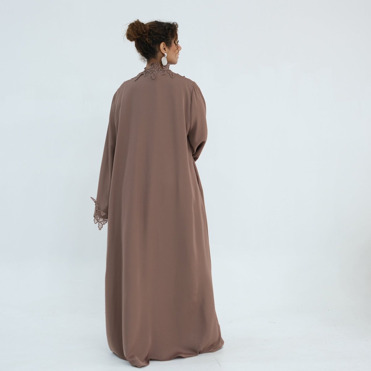 Layered look with open abaya and inner dress