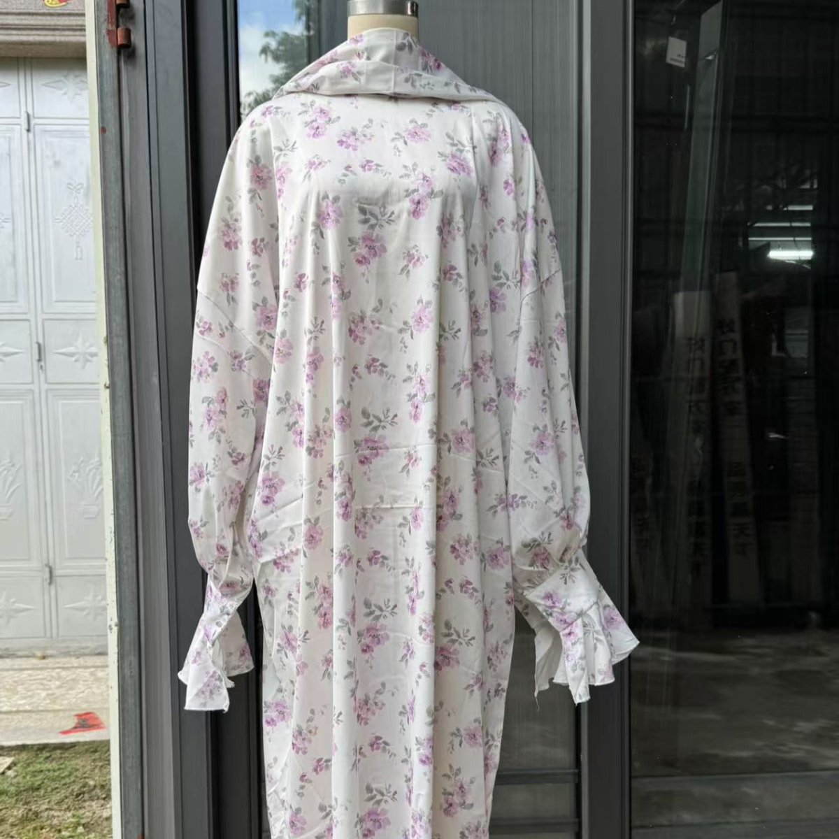 Loose-fit floral modest abaya with matching hijab in purple tones