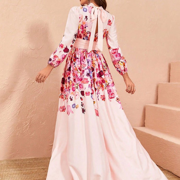 Close-up of bishop sleeves with gathered floral cuffs and satin belted waist detail