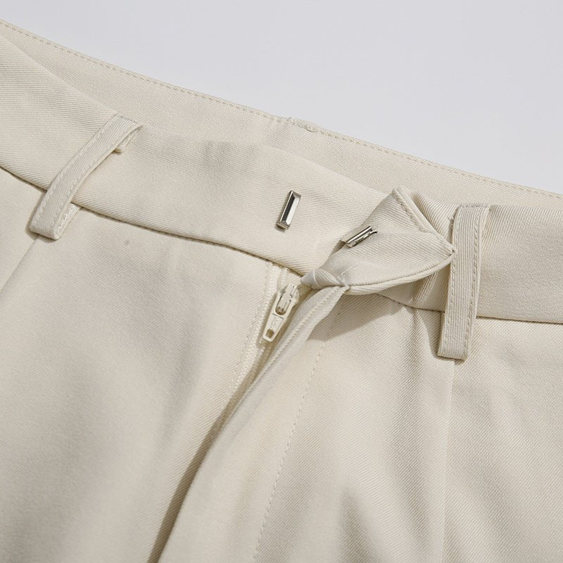 Apricot two-piece suit with polished tailoring and elegant drape