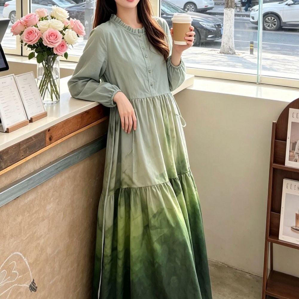 Full-length side profile of ombre gradient maxi dress with matching belt