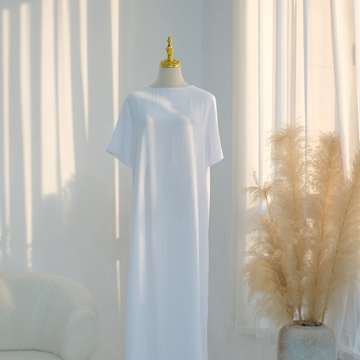 Full-length front view of white ice silk crinkle dress with crew neckline and short sleeves