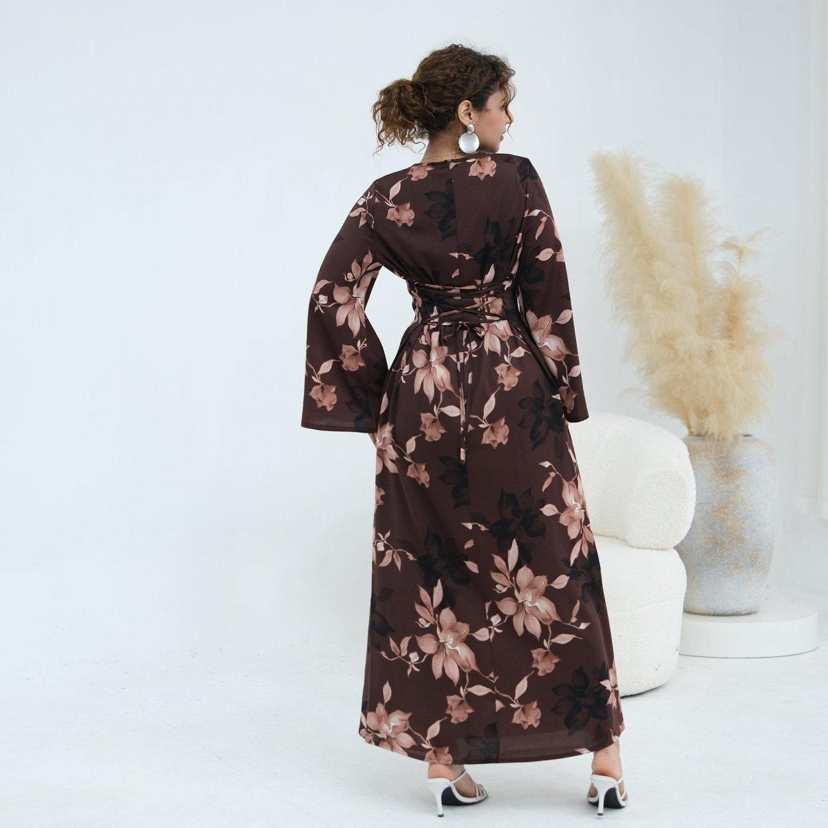 Waist belt styling detail on coordinating ink floral satin dress
