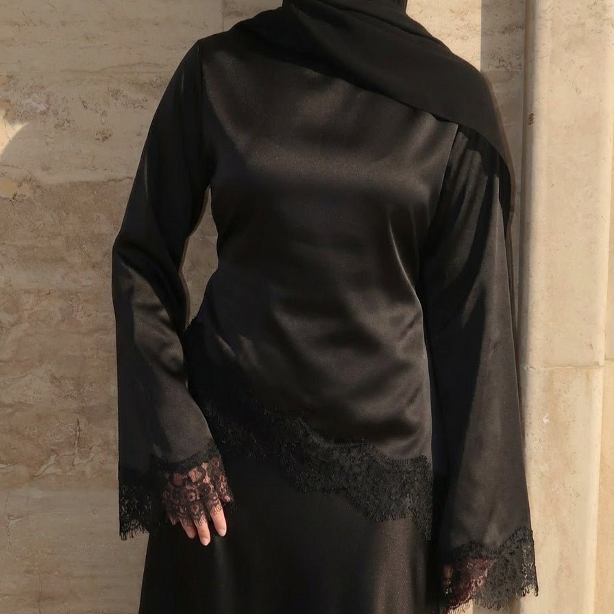 Back view showing diagonal contrast lace panel and self-tie waist ribbon