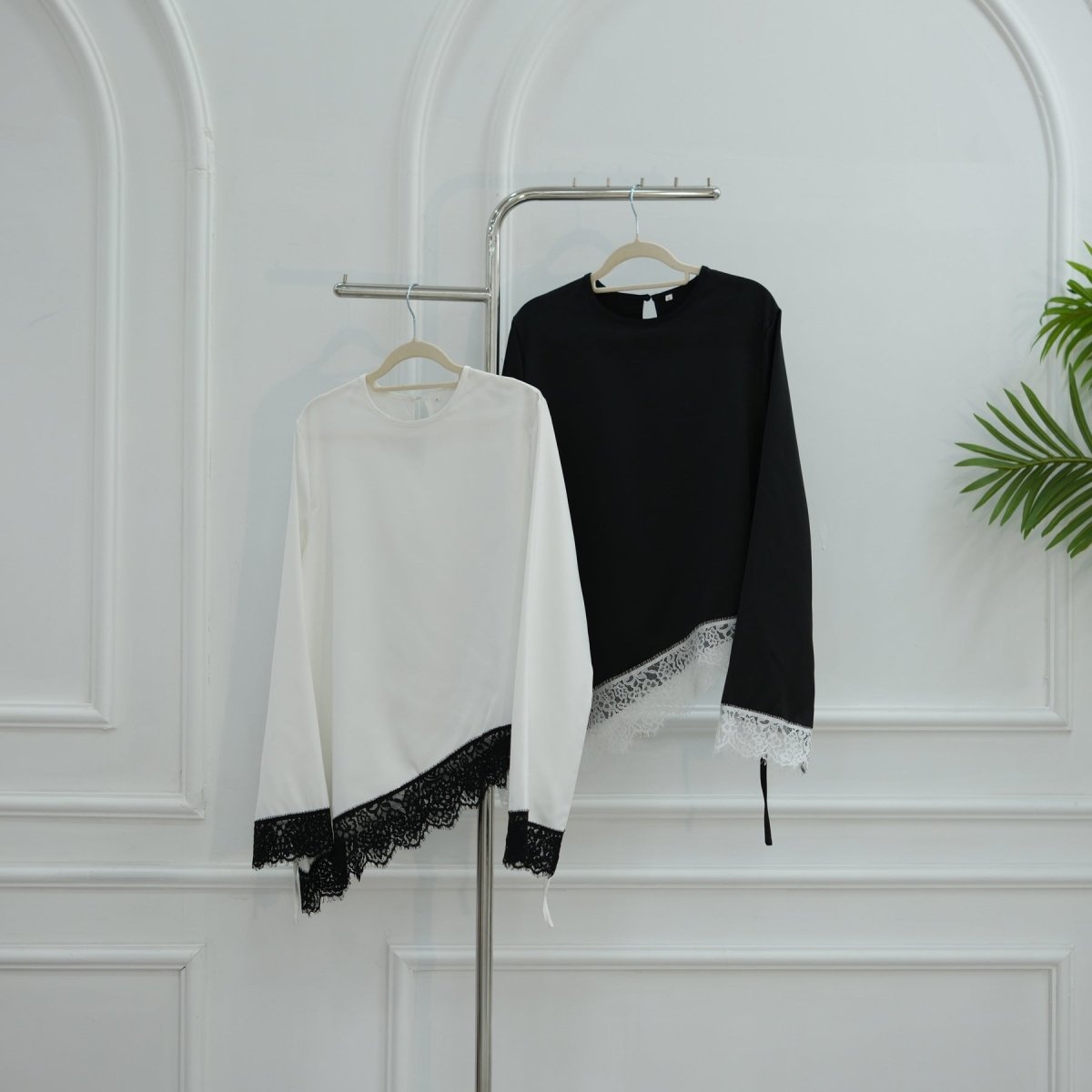 Model wearing bell sleeve contrast panel top styled with skirt