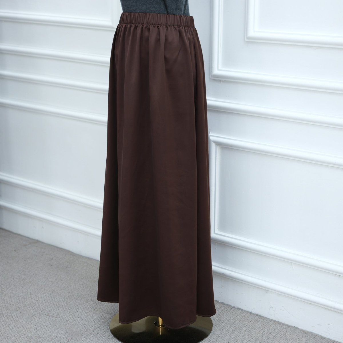 Side view of contrast panel satin top showing drape and movement