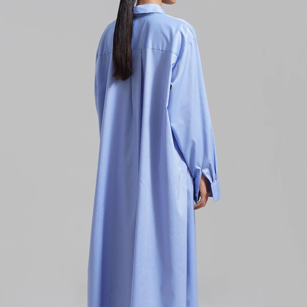 White oversized shirt dress hem and slit view