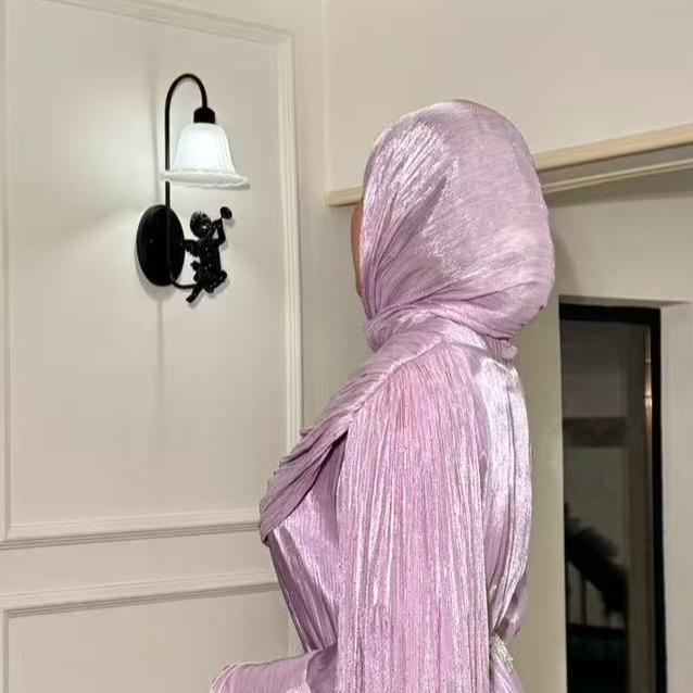 Side profile of cape sleeve maxi abaya with A-line silhouette