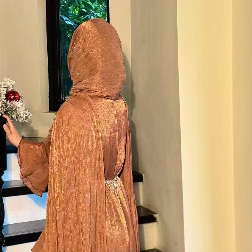 Full-length view of rhinestone silk abaya in soft neutral colourway