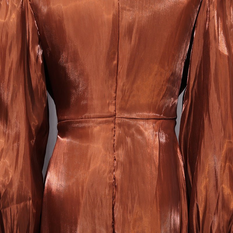 Full-length back view of copper bronze satin diagonal pleat maxi gown