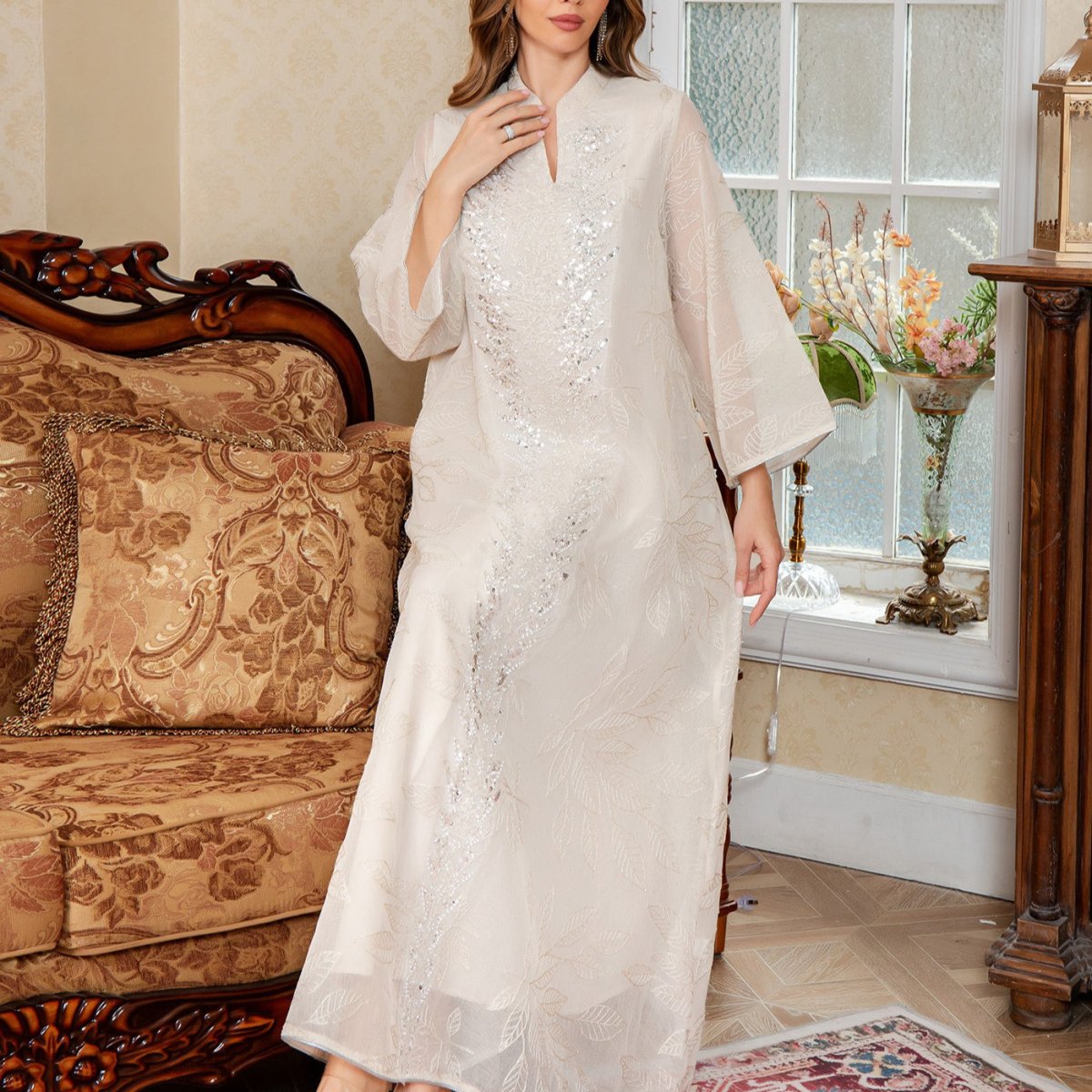 Luxury sequin mesh abaya in apricot with modest coverage and elegant drape