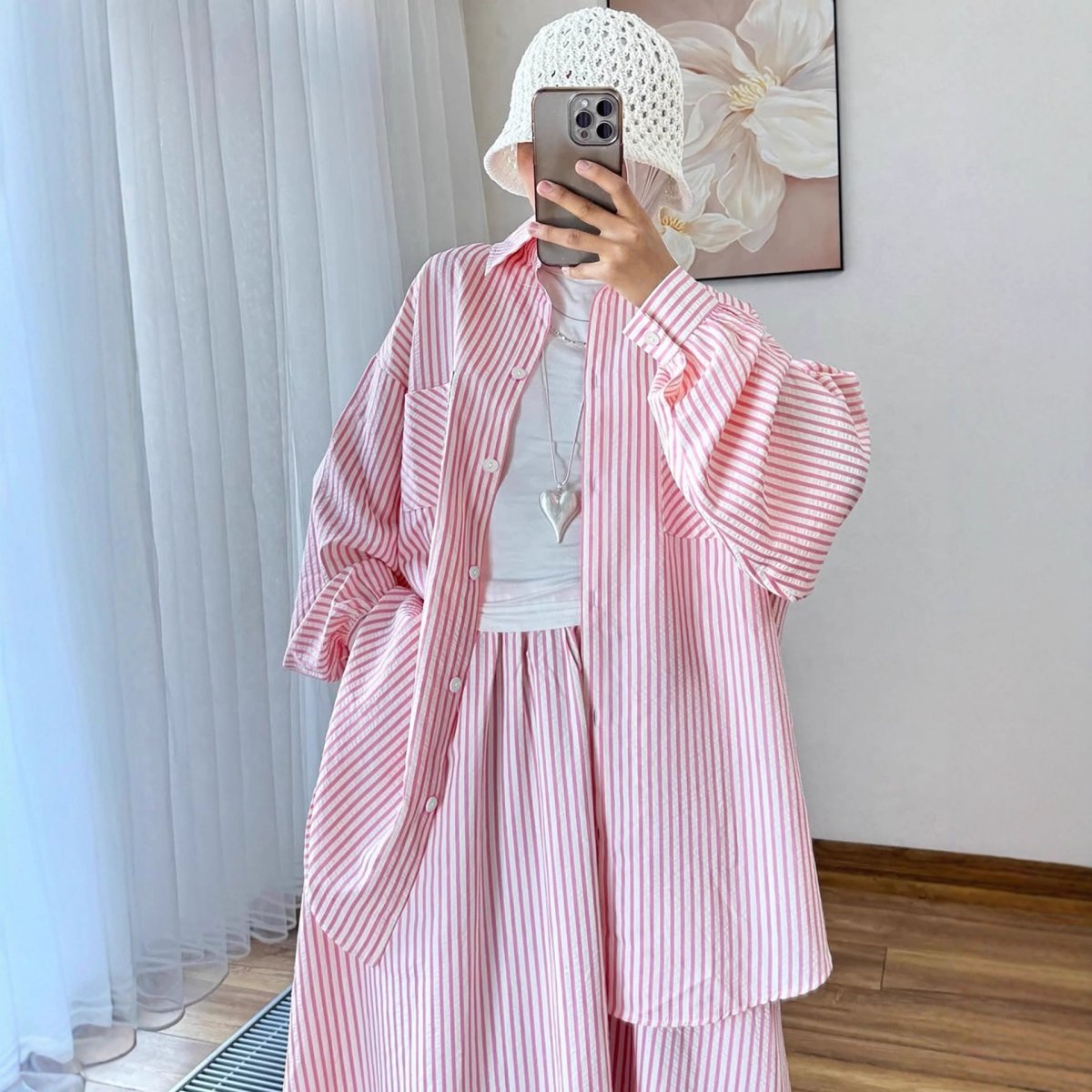 Striped oversized shirt in pink with classic stripe pattern and relaxed fit