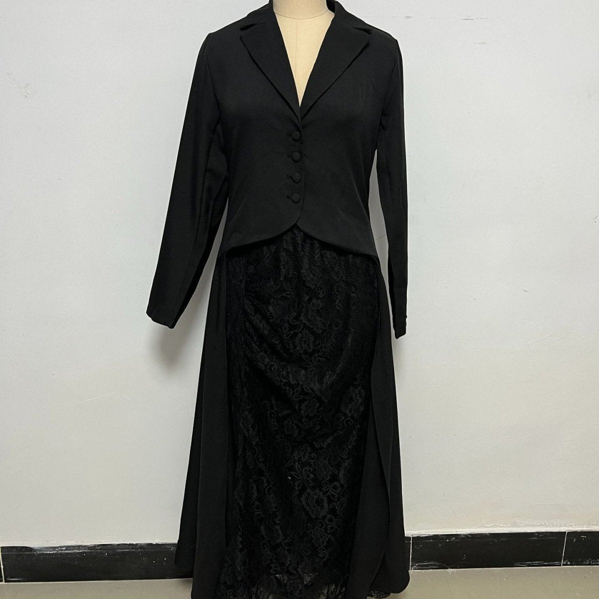 Close-up of sheer embroidered floral lace skirt overlay in classic black